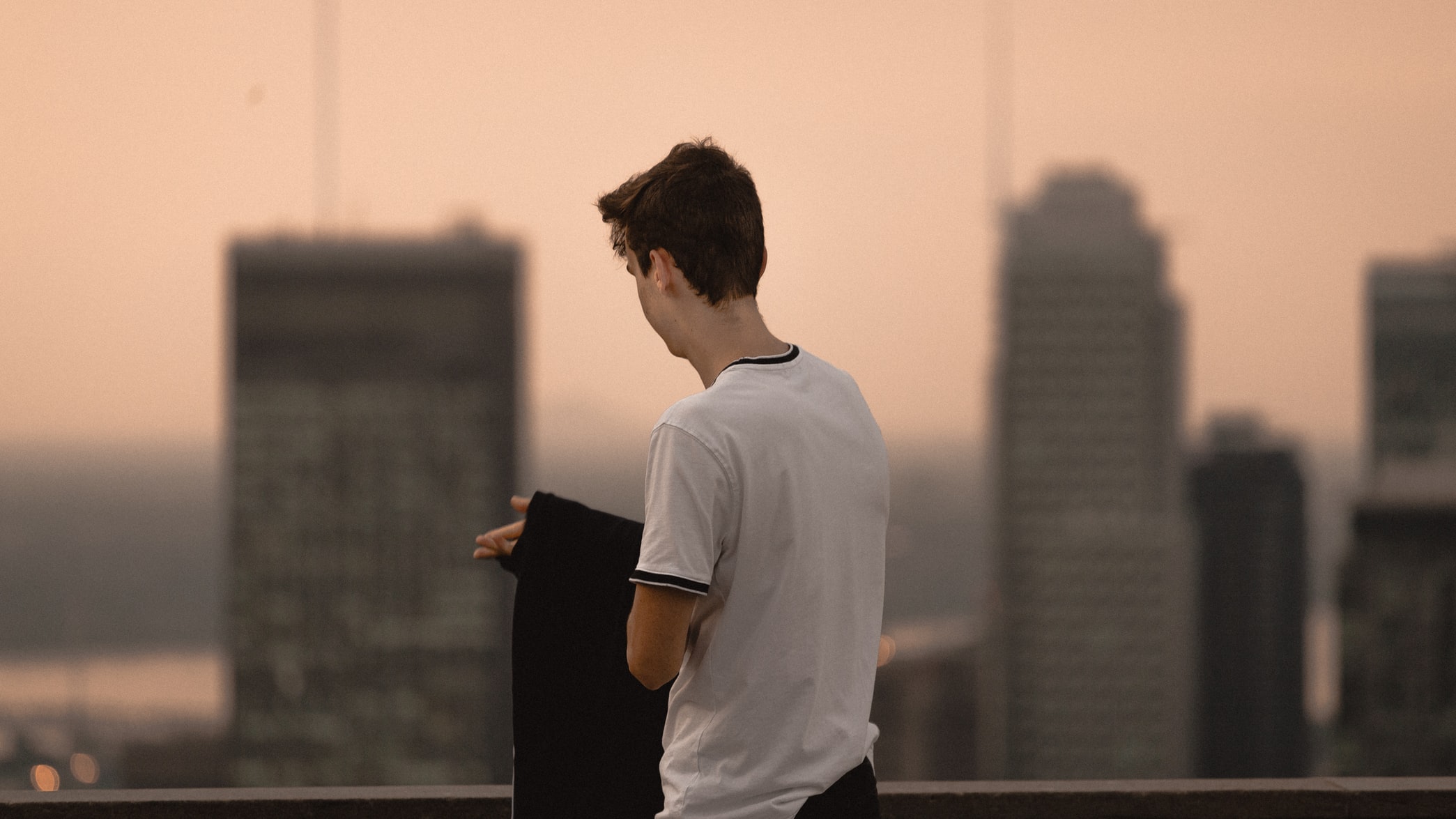 boy at building rooftop