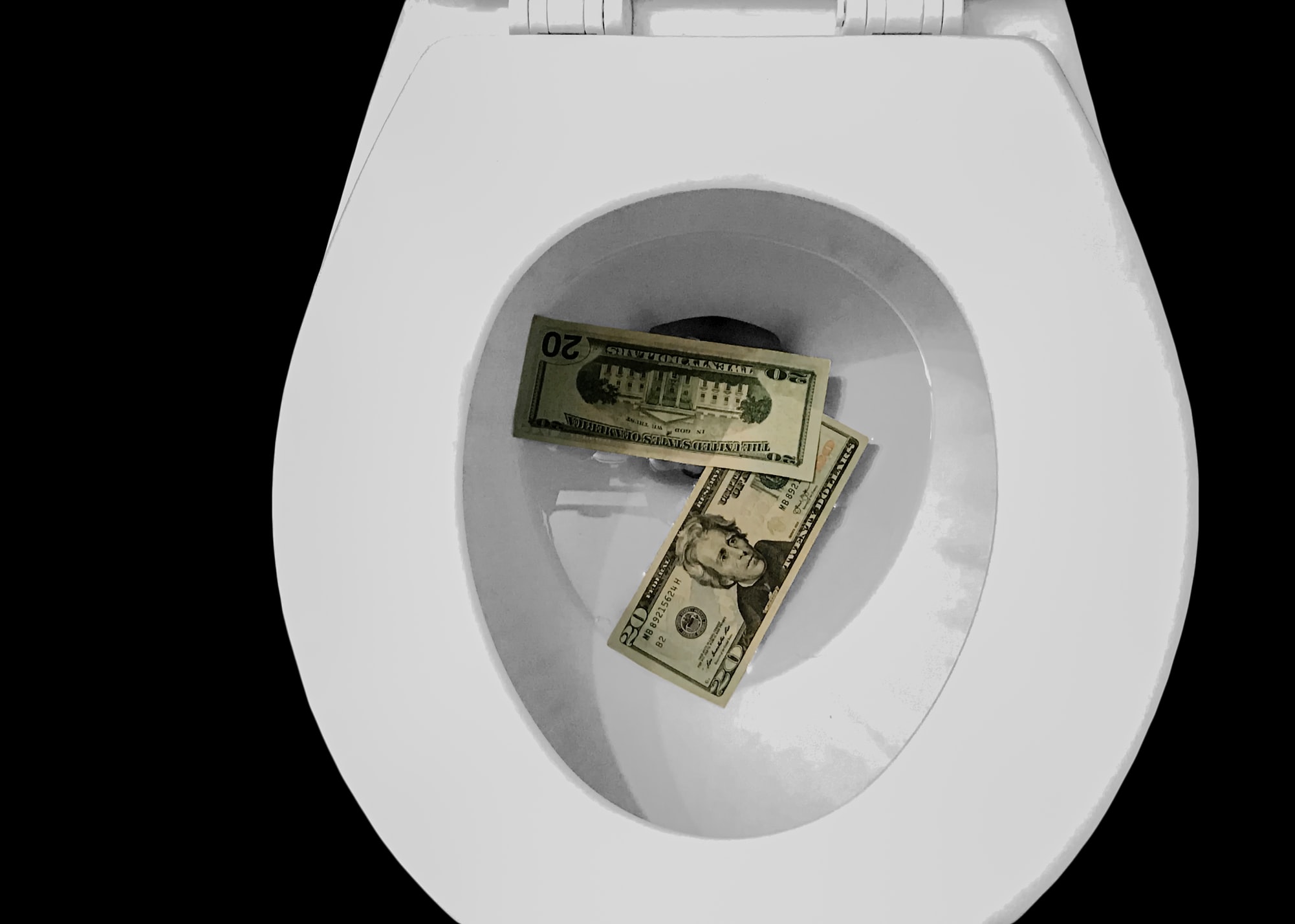 money on toilet bowl