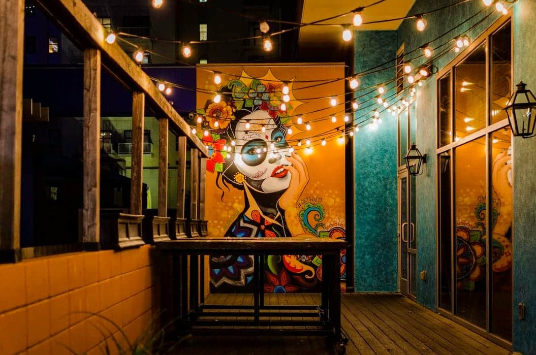 balcony with lights and an artwork as its centerpiece