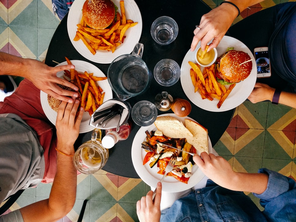 Friends eating burger and fries