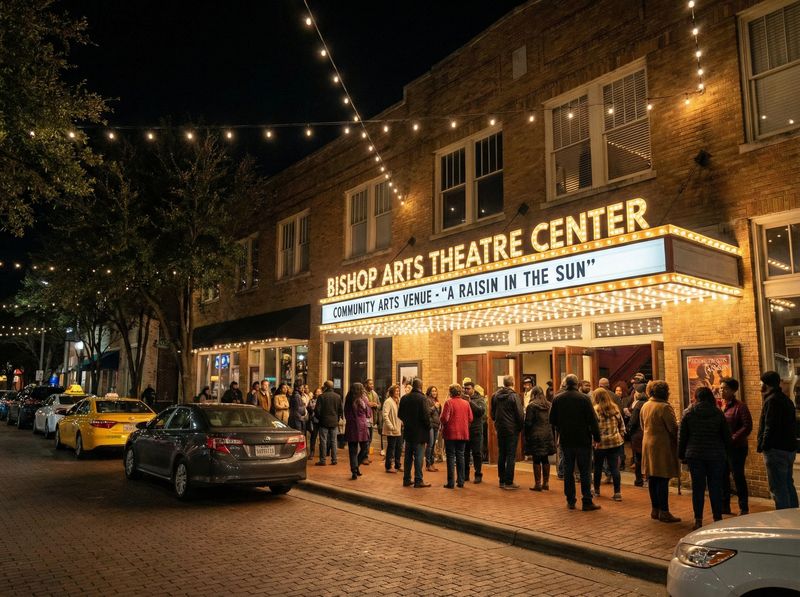 Theater entrance with nighttime crowd outside.
