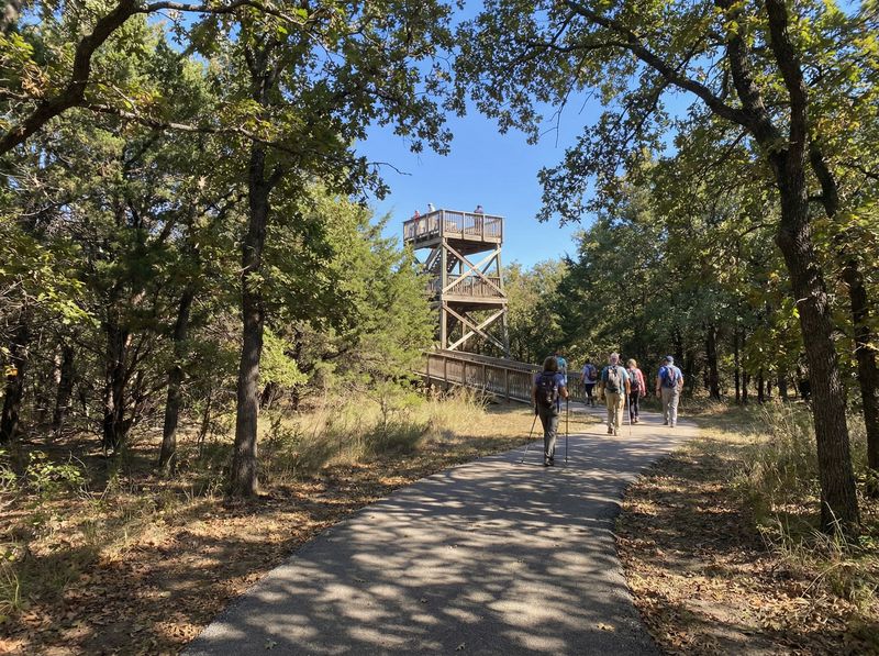 Hikers on trail near a lookout tower