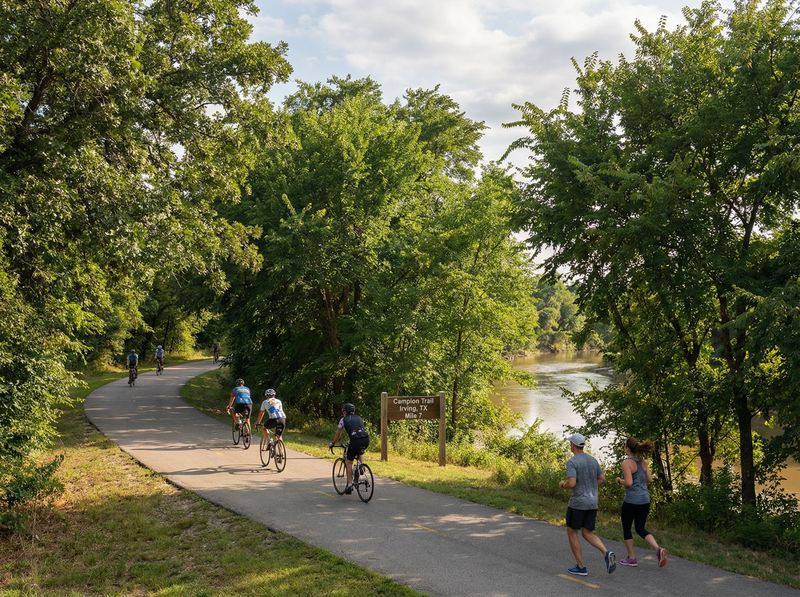 People biking and jogging on a nature trail