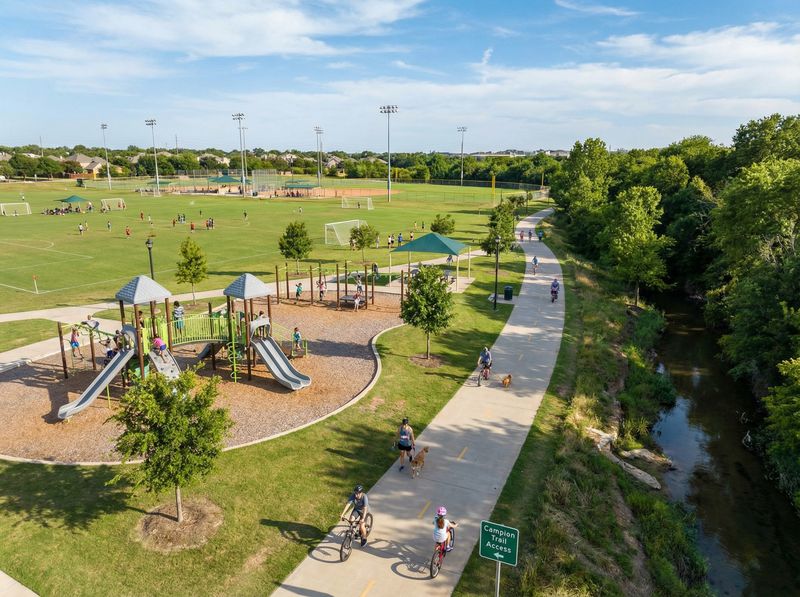 Park with playground, trails, and sports fields.