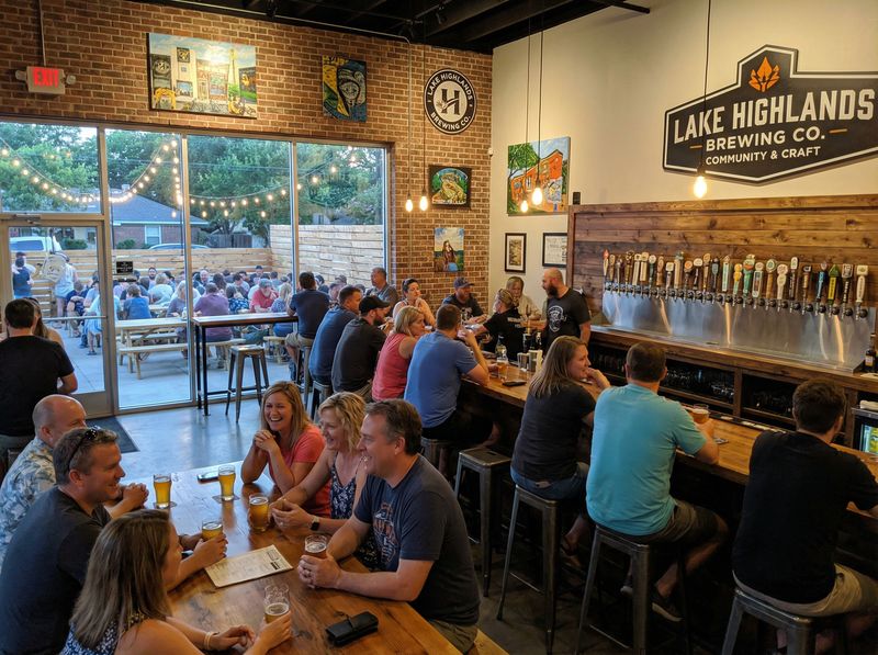 People enjoying drinks at a brewery.