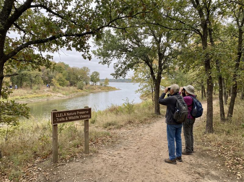 Hikers birdwatching at a nature preserve