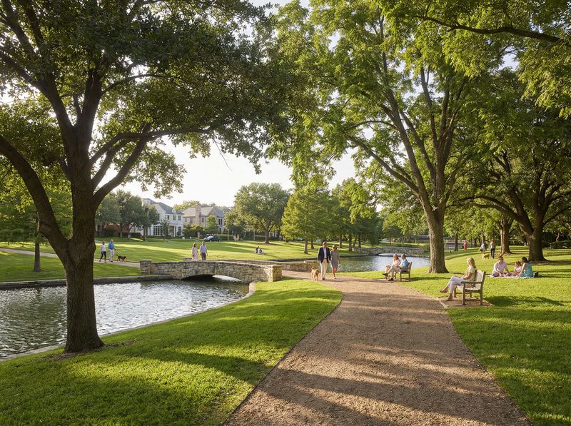 People enjoying a sunny park with a pond.