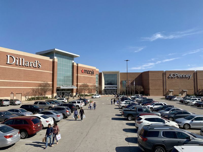 Exterior of shopping mall with parked cars