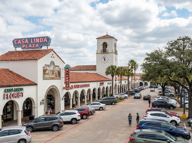 Shopping plaza with clock tower and cars