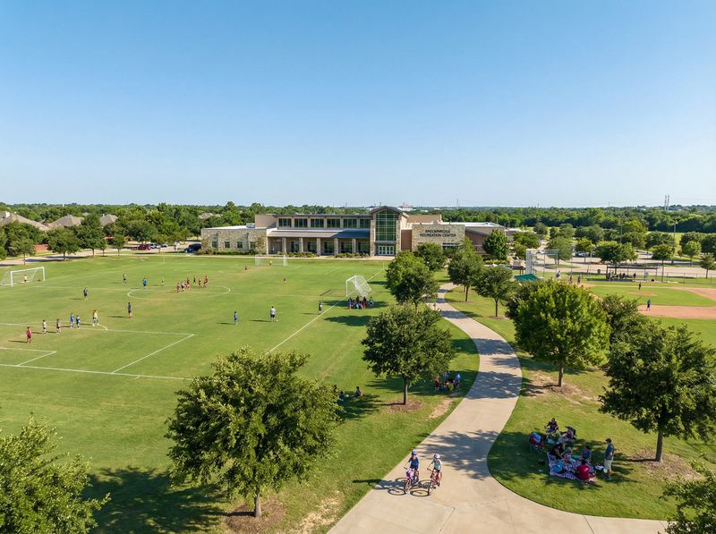 Soccer fields by recreational center building