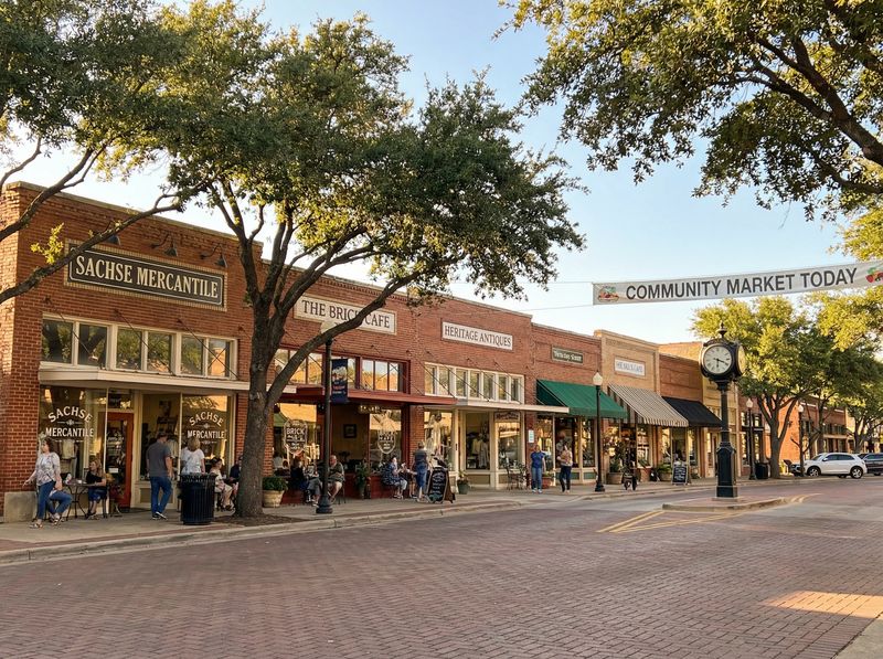 Charming small-town street with shops and trees