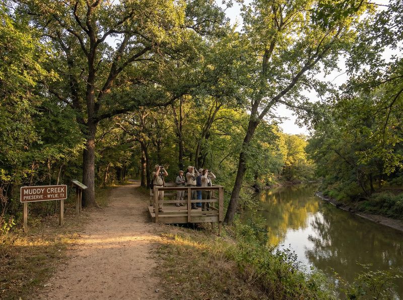 People birdwatching at Muddy Creek Preserve.